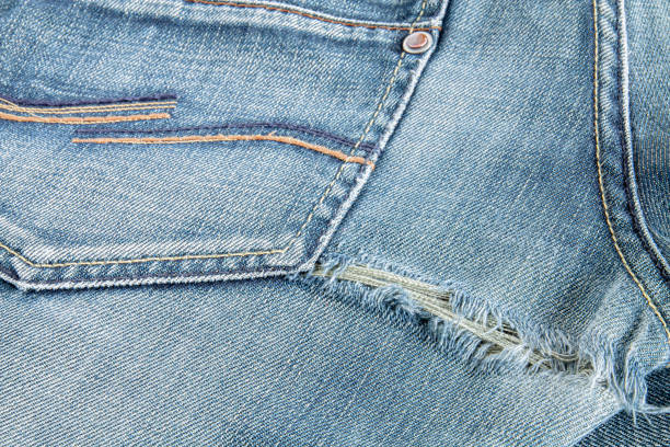 istock Ripped blue jeans at the back 2160287276