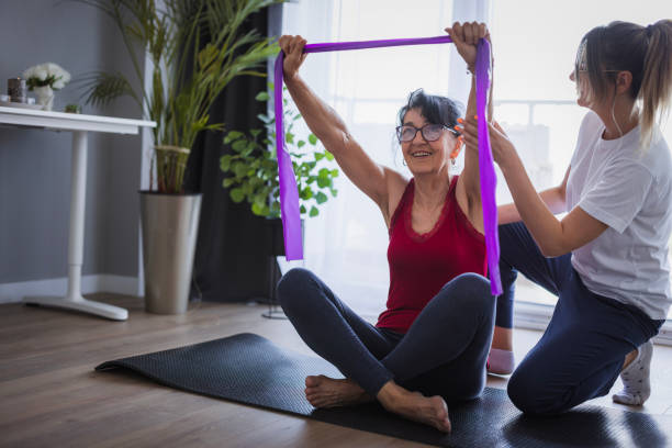 istock Woman enjoying exercise with resistance band 2160287449