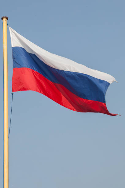 istock Russian flag on the mast, over blue sky 2160293103