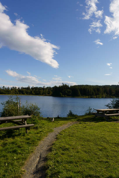 istock A serene picnic spot by a tranquil lake with a scenic backdrop 2160294745
