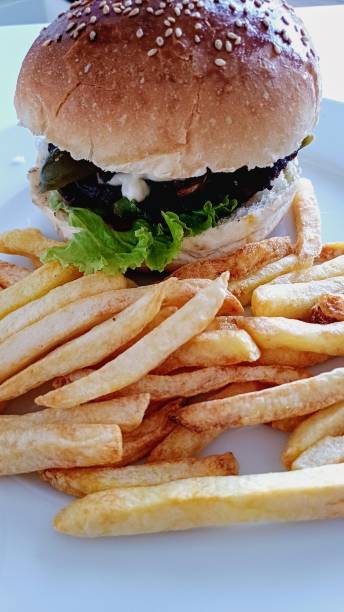 istock hamburger and fries 2160295926