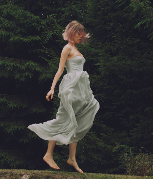 istock young beautiful woman in action at nature 2160296632