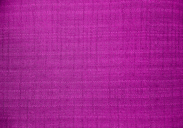 istock close up pink color fabric texture. fabric herringbone, zigzag, chevron pattern. purple upholstery or drapery abstract textile fabric background for design. 2160300828