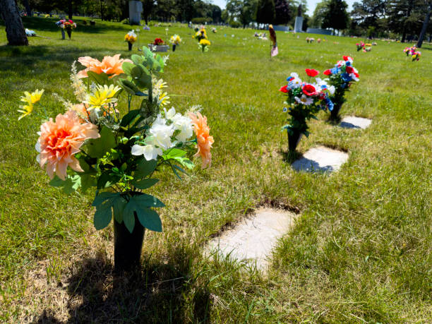 Artificial flowers on grave in cemetery