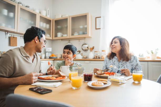 istock Family at home starting their day in the kitchen 2160305247