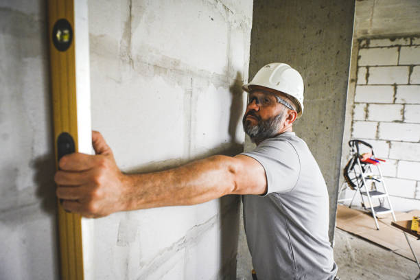 istock worker doing renovations in an apartment 2160305594