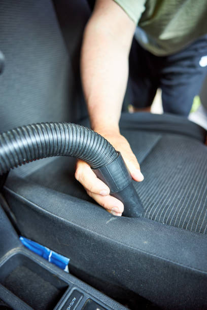 istock A man vacuums a car seat 2160305885