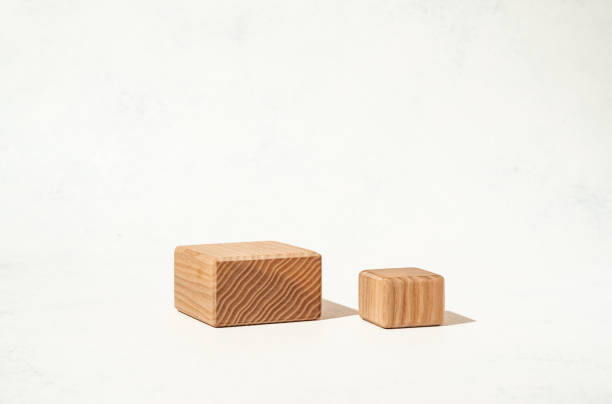 istock A mockup scene for presenting beauty cosmetics products, featuring textured wooden cube pedestals on a white background. Studio photography. 2160306860