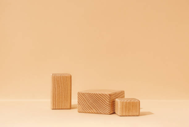 istock A mockup scene for presenting beauty cosmetics products, featuring textured wooden cube pedestals on a beige background. Studio photography. 2160306863