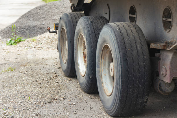 Old worn tires on truck wheels.