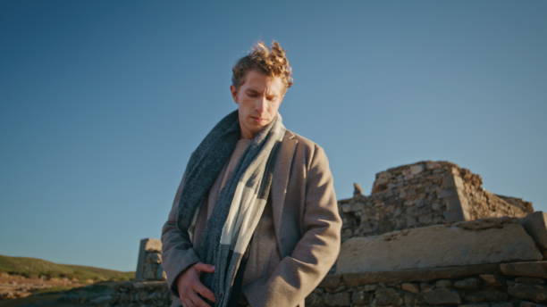 istock Thinking man touching scarf resting windy nature closeup. Guy walking nature 2160308350