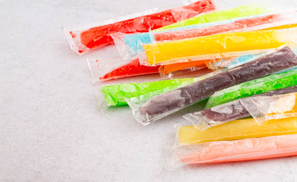 istock Mulicolored Frozen Ice Pop Popsicle on a Kitchen Counter 2160309900