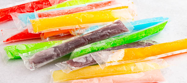 istock Mulicolored Frozen Ice Pop Popsicle on a Kitchen Counter 2160309908