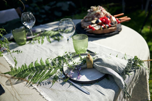 istock summer holiday table setting in the backyard in a forest-inspired green palette 2160310174
