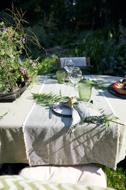 istock summer holiday table setting in the backyard in a forest-inspired green palette 2160310441
