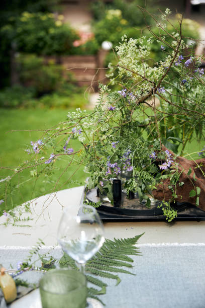 summer holiday table setting in the backyard in a forest-inspired green palette