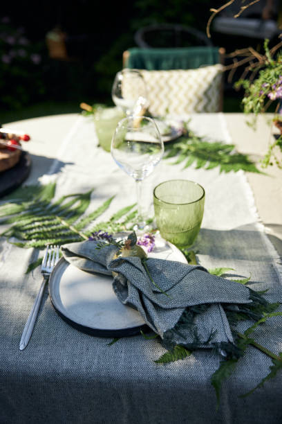 istock summer holiday table setting in the backyard in a forest-inspired green palette 2160310546