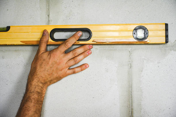 worker doing renovations in an apartment