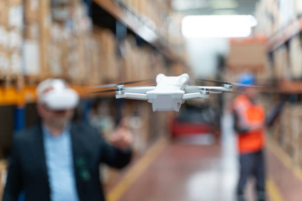 istock Businessman Utilizing Virtual Reality Headset for Warehouse Monitoring. 2160319320
