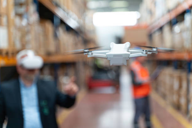 istock Businessman Utilizing Virtual Reality Headset for Warehouse Monitoring. 2160319391