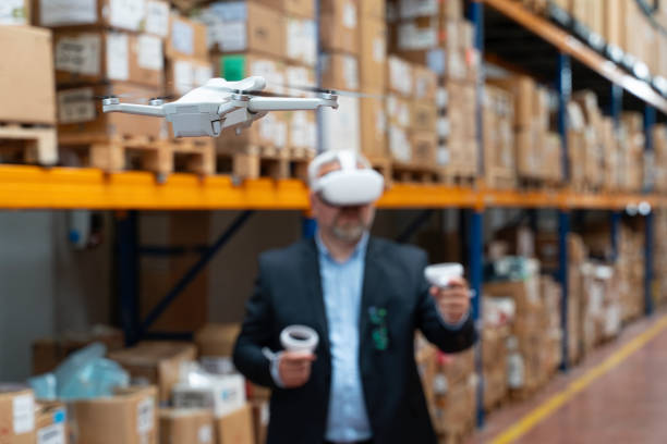 istock Businessman Utilizing Virtual Reality Headset for Warehouse Monitoring. 2160319420