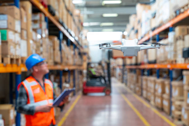 istock Businessman Utilizing Virtual Reality Headset for Warehouse Monitoring. 2160319449