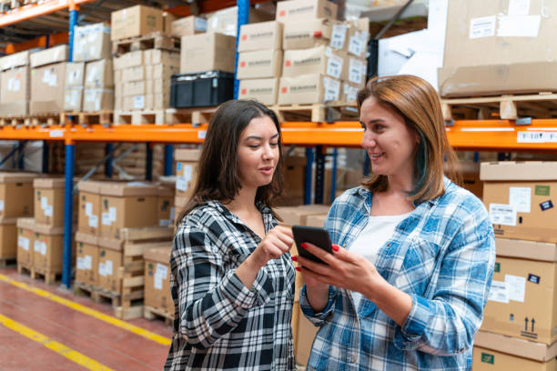 istock A customer family using a smartphone while scrolling through goods searching stock on the online shopping website or app in a retail warehouse market mall 2160320310