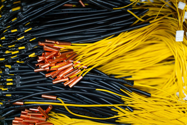 Black and yellow electrical wires with copper ends.