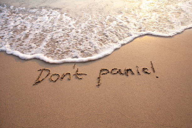 istock don't panic message on sand, calm down, no panic, anxiety 2160324666