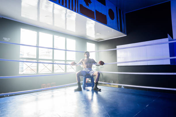 istock Young man boxer in the fighting ring 2160324888