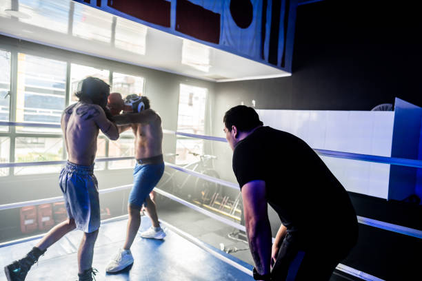 istock Men fighting with instructor's encouragement 2160324958