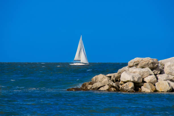 Sailboat on the seaside in the pretty town of Cervia in eastern Italy