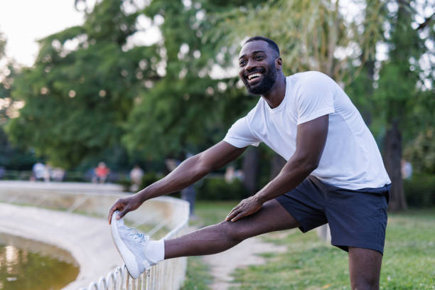 istock Man stretching outdoors in park after exercise 2160325804