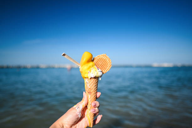 istock eating ice-cream at the beach 2160326431