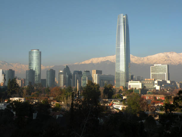 istock Group of business buildings with snowy mountain range in the background 2160330077