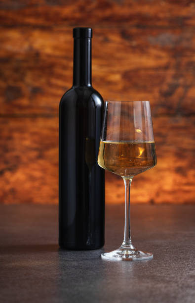 istock Excellent white wine on a wooden background 2160330191