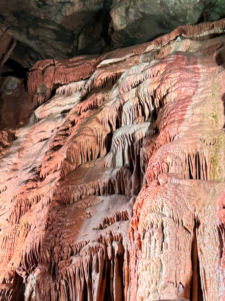 Stock photo showing close-up view of a cave stalactite rock formation.