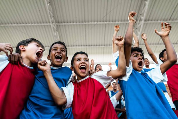 istock Children watching soccer match and celebrating on bleachers 2160333620