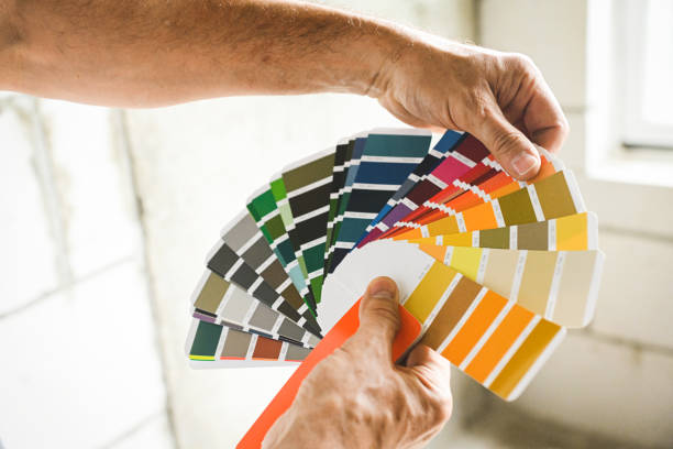 istock worker doing renovations in an apartment, Color Swatch, 2160336640
