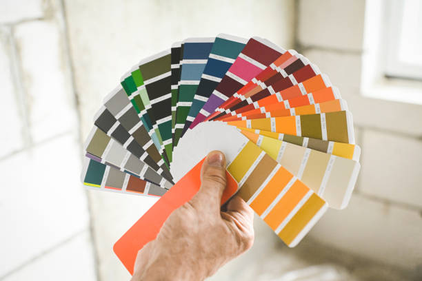 istock worker doing renovations in an apartment, Color Swatch, 2160337526