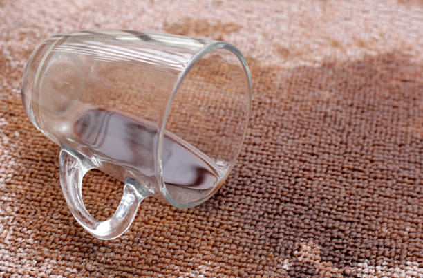 istock Coffee spilled from a cup on the carpet 2160338214