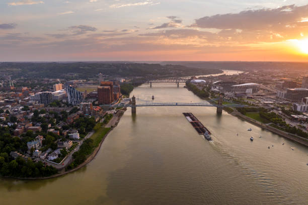 istock Covington, Kentucky USA. Skyline with bridge traffic and brightly illuminated high skyscraper buildings in modern American city 2160338444