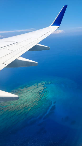 istock Aerial View from Airplane Over Ocean and Coral Reef 2160348191