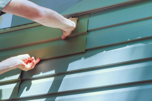 istock During construction, worker installs vinyl plastic siding panels on a home facade 2160348274