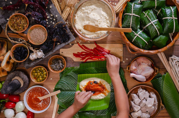 istock Wooden table with ingredients to make tamales. 2160350700