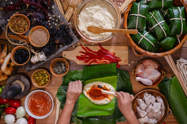 istock Wooden table with ingredients to make tamales. 2160350727