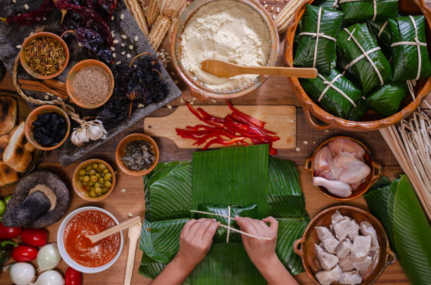 istock Wooden table with ingredients to make tamales. 2160351311