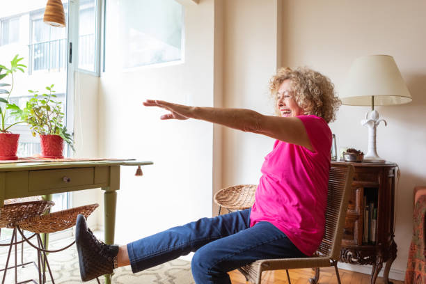 istock Senior woman doing physical therapy exercises at home 2160353469