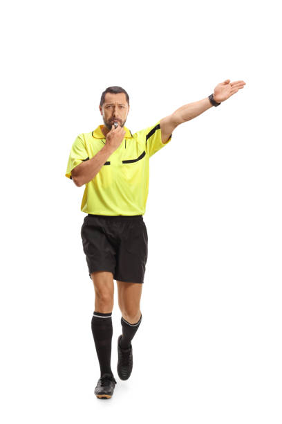 istock Football referee walking and blowing a whistle 2160356034