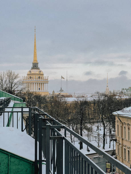istock Snow-Capped Urban Landscape with Distant Spire and Rooftop View 2160356617